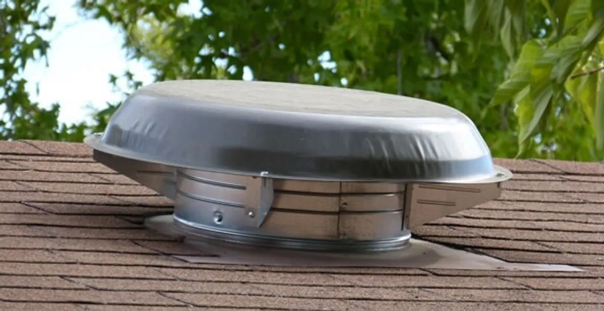 attic fan installation services with low-profile roof ventilation unit in Minneapolis, MN