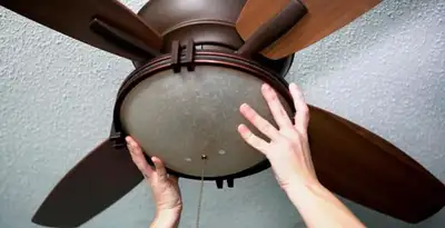 Ceiling fan repair and reinstallation on ceiling mount in Minneapolis, MN