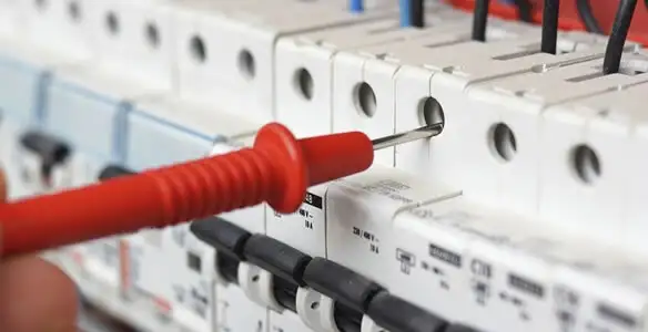 Electrical contractor testing circuit breakers during electrical repair in South Saint Paul, MN