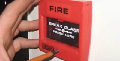 fire alarm installation service showing manual fire alarm pull station installed by licensed electricians in Minneapolis, MN