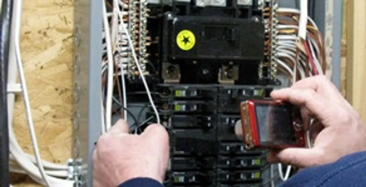Home electrical inspection of circuit breaker panel by licensed electrician in Minneapolis, MN