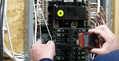 Home electrical inspection of circuit breaker panel by licensed electrician in Minneapolis, MN