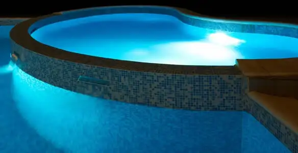 pool light installation and repair services highlighting illuminated pool interior lighting in Minneapolis, MN