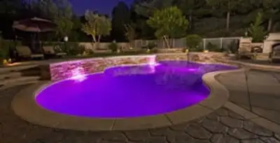 pool light installation and repair services illuminating a residential swimming pool in Minneapolis, MN