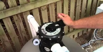 pool pumps service showing professional adjustment of pool pump control system in Minneapolis, MN