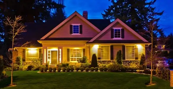 security light installation services illuminating a residential exterior at night in Minneapolis, MN