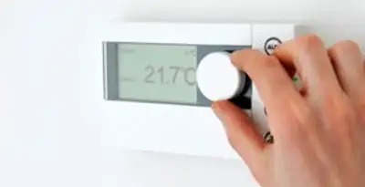 Thermostat installation service with professional adjusting temperature control in Minneapolis, MN