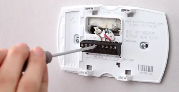 Thermostat installation service with proper wiring and secure wall mounting in Minneapolis, MN