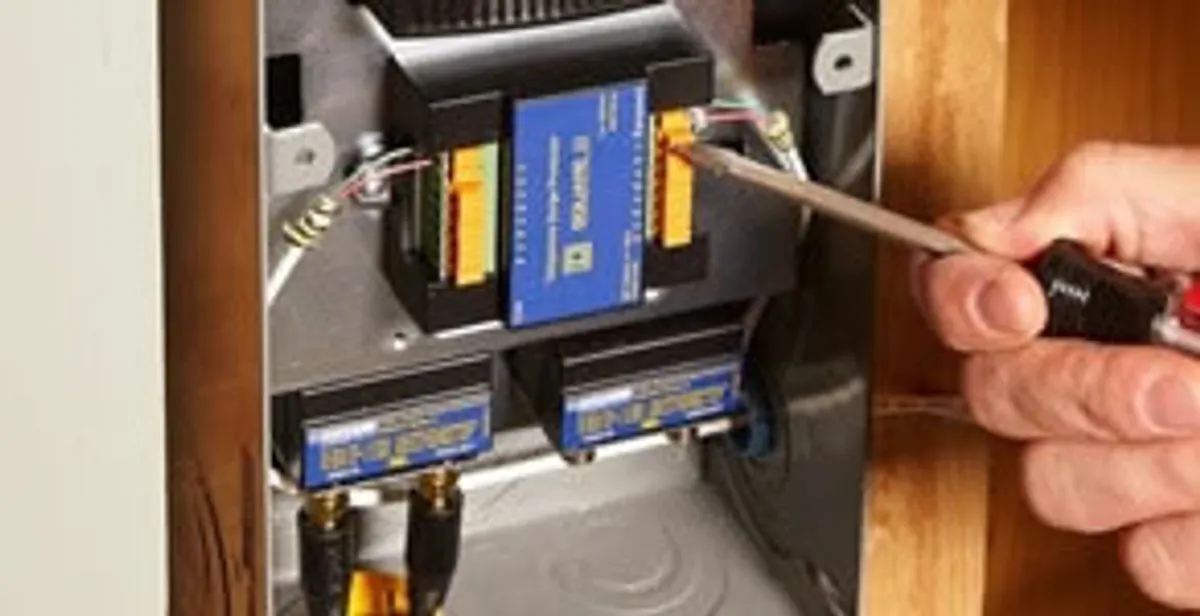 Whole home surge protection device being installed by a licensed electrician to protect electrical systems in Minneapolis, MN